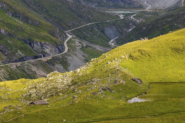 A pass road leads to the Moiry glacial lake, above Grimentz, Val d'Anniviers, Valais Alps, Canton Valais, Switzerland