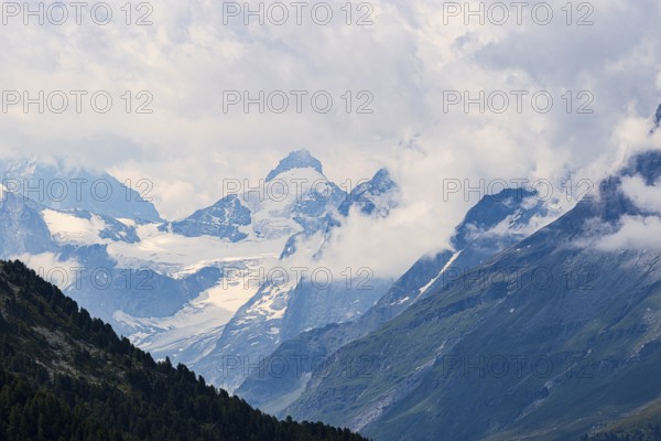 Four-thousand metre mountains and glaciers in clouds, above Zinal, Val d'Anniviers, Valais Alps, Canton Valais, Switzerland