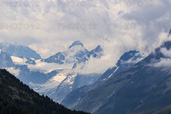 Four-thousand metre mountains and glaciers in clouds, above Zinal, Val d'Anniviers, Valais Alps, Canton Valais, Switzerland