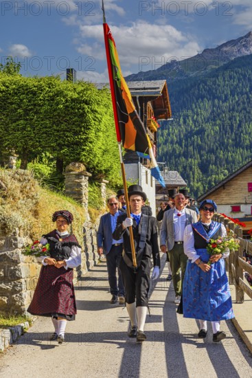 Drummers' and pipers' meeting in Mission, here the entry of a music group led by a standard-bearer, Val d'Anniviers, Valais Alps, Canton Valais, Switzerland