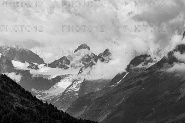 Four-thousand metre mountains and glaciers in clouds, black and white photograph, above Zinal, Val d'Anniviers, Valais Alps, Canton Valais, Switzerland