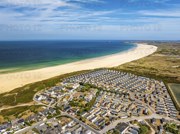 Holiday homes over Hayle Beach and Hayle Estuary from drone, St Ives Bay, Cornwall, England, United Kingdom