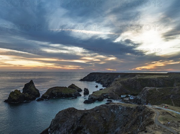 Sunset over Kynance Cove from a drone, Mount's Bay, Lizard Point, Cornwall, England, United Kingdom