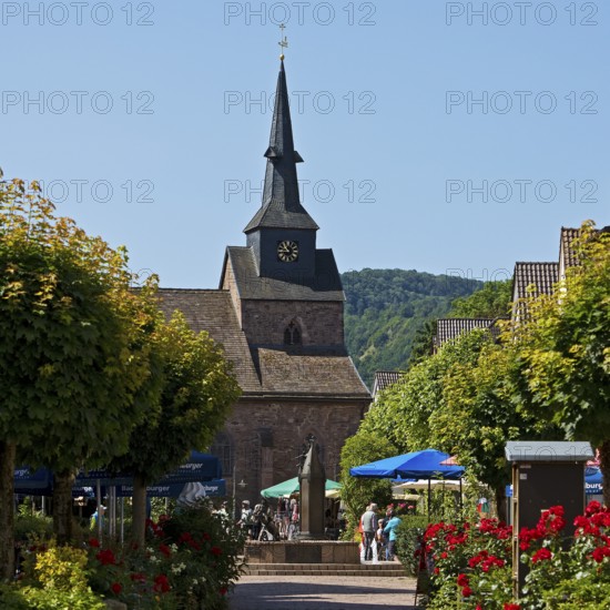 Pedestrian zone to the Protestant town church of St Nicolai in the Münchhausen town of Bodenwerder, Lower Saxony, Germany