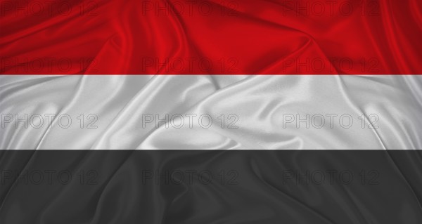 Flag of Yemen with cloth texture. Close up of Yemen flag waving