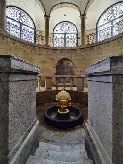 Sacred atmosphere, spa fountain in the fountain temple of the drinking spa complex, healing spring emerging from the golden ball, Bad Nauheim, Hesse, Germany