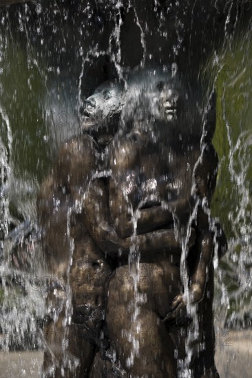 Fountain of Knowledge by Heinrich Jobst, close-up in the large spa gardens of Bad Nauheim, Hesse, Germany