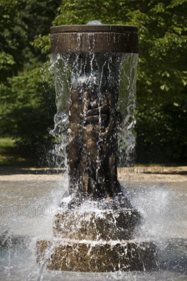 Fountain of Knowledge by Heinrich Jobst in the large spa gardens of Bad Nauheim, Hesse, Germany