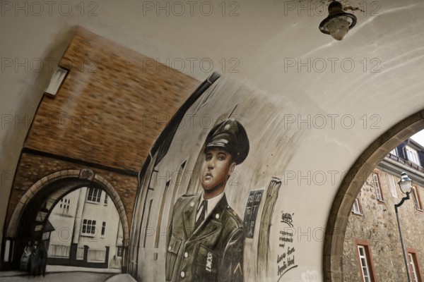 Graffiti by Gnasher in the archway, the castle gate was the backdrop for the cover of the Elvis Presley single A Big Hunk o' Love, Bad Nauheim, Hesse, Germany