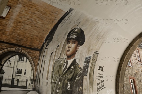 Graffiti by Gnasher in the archway, the castle gate was the backdrop for the cover of the Elvis Presley single A Big Hunk o' Love, Bad Nauheim, Hesse, Germany