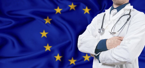 European Union healthcare concept. Male doctor on European Union flag. Doctor with crossed arms on European Union flag
