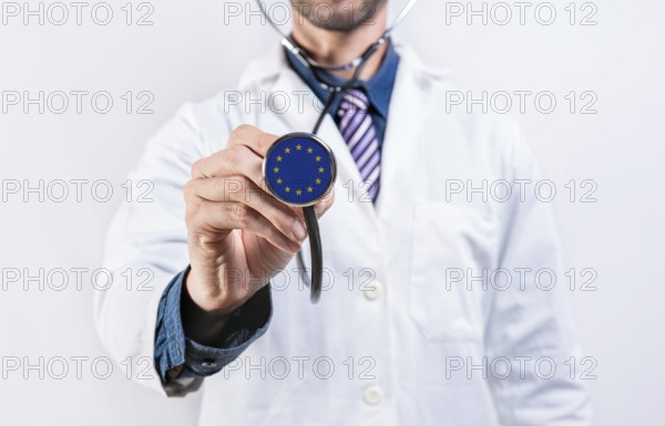 European Union healthcare system, doctor holding stethoscope. European Union health and medical insurance concept