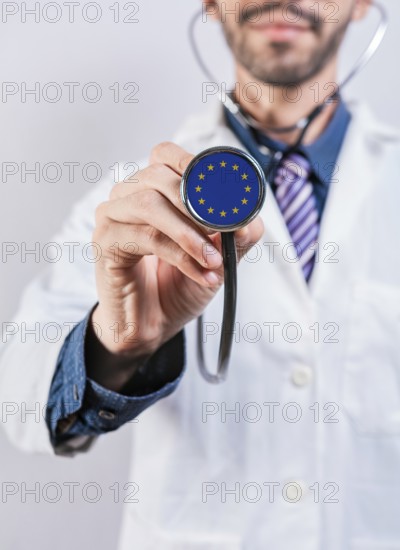 European Union health and medical insurance concept. European Union healthcare system, doctor holding stethoscope