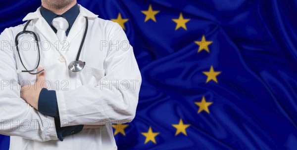 Male doctor with stethoscope on European Union flag. Doctor holding stethoscope on European Union flag