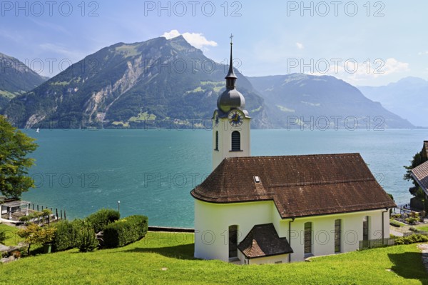 Roman Catholic Church of St Idda, Lake Lucerne in the background, Bauen, Canton, Uri, Switzerland