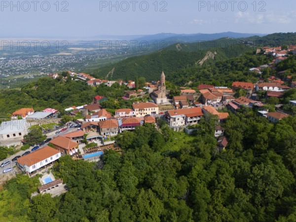 Sweeping view over a hilly region with town and traditional buildings, aerial view, Sighnaghi, Signagi, Kakheti Province, Greater Caucasus, Georgia, Near East