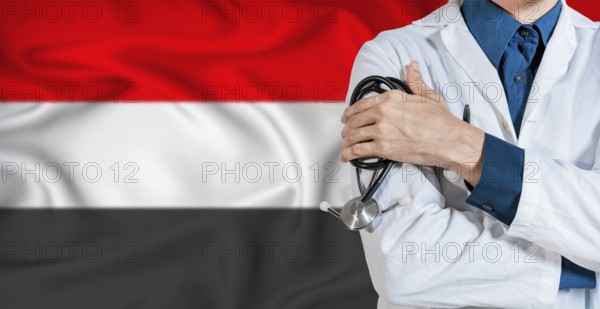 Doctor with stethoscope on Yemen flag. Doctor holding stethoscope on Yemen flag