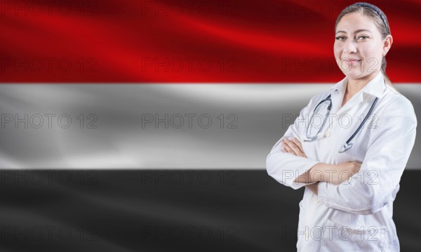 Female doctor on Yemen flag. Doctor with crossed arms on Yemen flag. Yemeni health and care concept