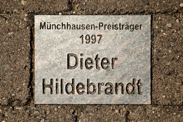 Sign for the 1997 Münchhausen Prize winner Dieter Hildebrandt in the Münchhausen town of Bodenwerder, Weserbergland, Lower Saxony, Germany