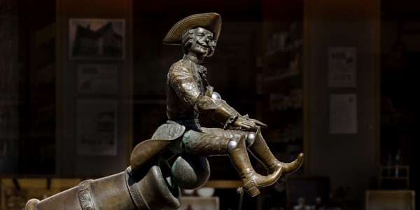 Munchausen figure, The Ride on the Cannonball, Munchausen Fountain by Bonifatius Stirnberg in Bodenwerder, Weserbergland, Lower Saxony, Germany