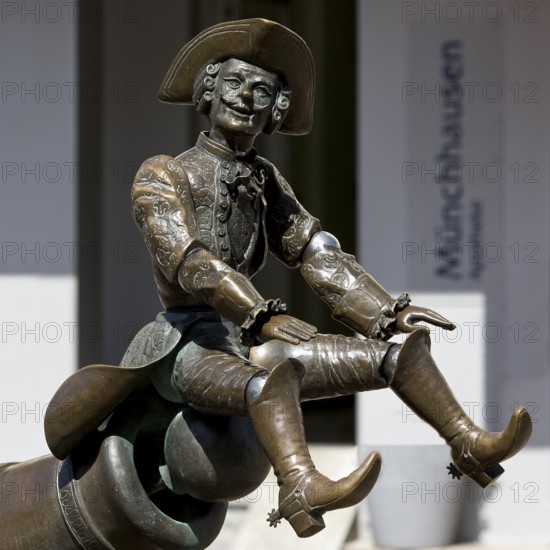 Munchausen figure, The Ride on the Cannonball, Munchausen Fountain by Bonifatius Stirnberg in Bodenwerder, Weserbergland, Lower Saxony, Germany