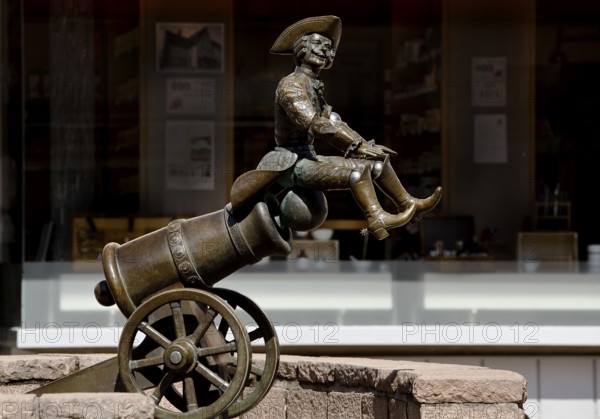 Munchausen figure, The Ride on the Cannonball, Munchausen Fountain by Bonifatius Stirnberg in Bodenwerder, Weserbergland, Lower Saxony, Germany