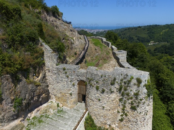 Old castle ruins amidst lush vegetation and under a clear sky, aerial view, Ünye Castle, Ünye Kalesi, Inkur, Ünye, Ordu Province, Turkey