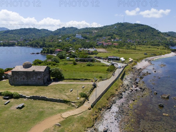 Panoramic view of a church along the coast surrounded by hills and water in a summer atmosphere, aerial view, Yason Church, Cape Jason, Çaytepe, Ordu Province, Turkey