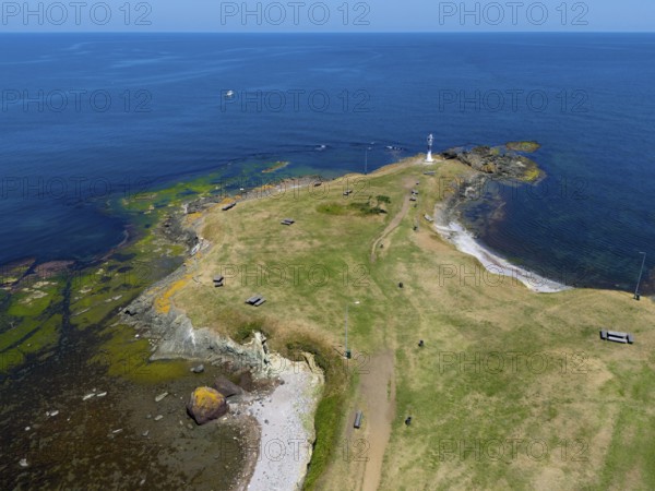 Aerial view of a small island with a lighthouse and green areas surrounded by the blue sea, aerial view, Yason Burnu lighthouse, Cape Jason, Çaytepe, Ordu province, Turkey