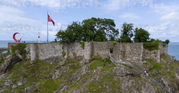 Close-up of a castle on a rock with flag, surrounded by nature, aerial view, fortress, castle, Tirebolu, Giresun Province, Black Sea, Turkey