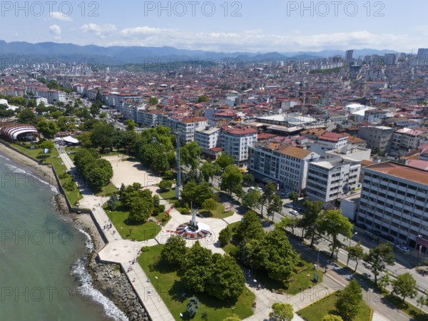 Densely built-up town with parks on the coast, surrounded by mountains and architecture with red roofs, aerial view, Altinordu, Altinordu, Ordu province, Turkey