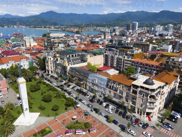 Historic buildings and central squares in a colourful coastal town with mountains, aerial view, Europe Square, Batumi, Black Sea, Adjara region, Adjara, autonomous republic, Georgia