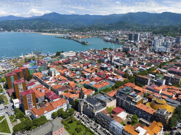 Panoramic view over the city with colourful roofs and mountains in the background, aerial view, Batumi, Black Sea, Adjara region, Adjara, autonomous republic, Georgia