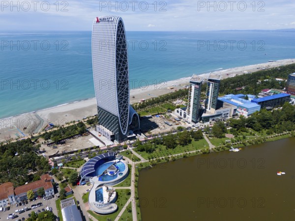 Unique building on the beach next to modern structures and sea, aerial view, Hotel Alliance Privilege, Batumi, Black Sea, Adjara region, Adjara, autonomous republic, Georgia