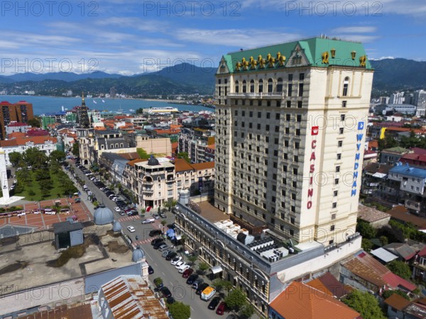 Large hotel building in a coastal town with mountains in the background and lively street scene, aerial view, Princess Casino, Batumi, Black Sea, Adjara region, Adjara, autonomous republic, Georgia