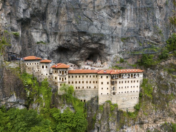 Monastery built into the rock with red roofs, surrounded by steep rock faces, aerial view, Sumela Monastery, Sümela Manastiri, Maçka, Macka, Trabzon Province, Turkey
