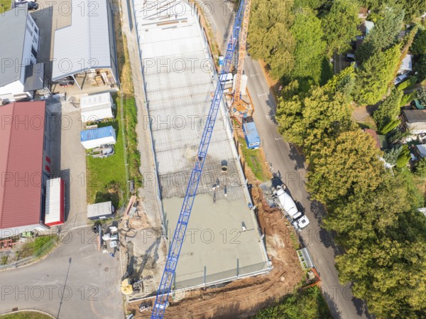 Aerial view of a construction site, surrounded by buildings and green landscape, car park construction, Calw, Germany