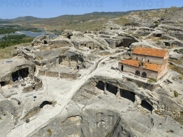 Architecture of the ancient cave city of Uplistsikhe with ruins and spectacular rock panorama, aerial view, cave city Uplistsikhe, Uplistsikhe, river Kura or Mtkvari, Inner Kartlia region, Shida Kartli, Georgia