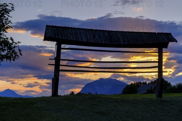 Sunset, hayrack, hayrack, at the ruins of Finkenstein Castle, on Lake Faak, Carinthia, Austria