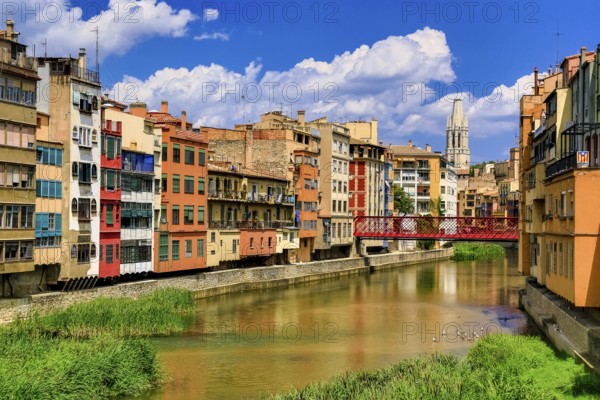 Red bridge over the river Onyar built by the Eiffel company, colourful facades over the river Onyar, Girona, Cataluña, Gerona, Catalonia, Spain, Cataluña, Europe, aerial view, birds-eyes view, aerial photography, aerial photography, overview, bird's eye view