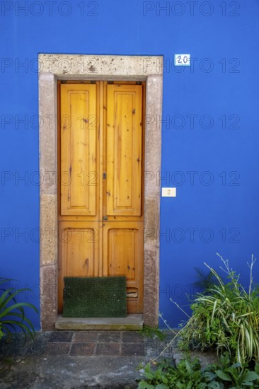 Sardinia, Blue House with picturesque door, Bosa, Europe, Province of Oristano, Italy, architecture, exterior, Blue House, detail, entrance, colours, facade, building, identity, travel, sight, sightseeing, city, tourism, urban, residential, charming, decorative, European, historic, Italian, cultural, picturesque, picturesque door, Mediterranean, traditional, typical, aesthetics