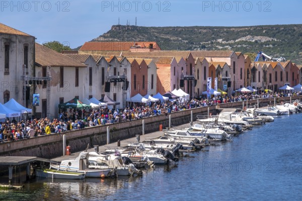 Sardinia, boats in the river Temo and houses on the promenade, guests at the restaurants with outdoor catering, Bosa, Europe, province of Oristano, Italy, old town, architecture, outdoor catering, boats, relaxation, recreation, food, river Temo, river promenade, riverside, leisure, spring, building, guests, people, promenade, travel, restaurants, sightseeing, summer, sunlight, town, pavement cafés, day, tourism, drinking, shore, holiday, water, residential, historic, picturesque, Mediterranean, traditional