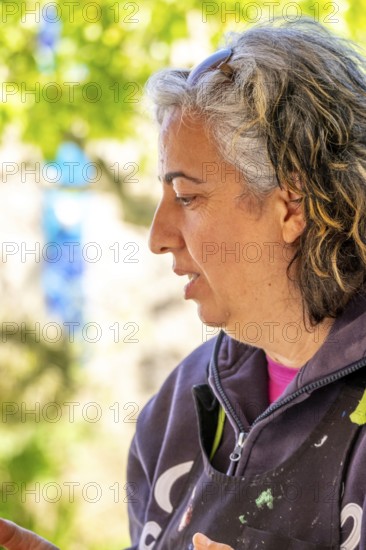 Sardinia, Pina Monne, female portrait and artist, Tinnura, Europe, Province of Oristano, Italy, studio, expression, exhibition, emotion, colour, woman, female portrait, hairstyle, gallery, face, craft, identity, inspiration, clothing, creativity, culture, art, artwork, artist, canvas, painting, people, facial expression, Mediterranean, portrait, beauty, sightseeing, tourism, European, Italian, local talent, traditional, female
