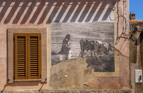 Sardinia, house with mural, Sardinian landmark, Tinnura, Europe, Province of Oristano, Italy, architecture, expression, exterior, design, detail, village, colour, facade, photography, building, history, society, house, identity, culture, art, local colour, masterpiece, Murals, region, guide, destination, sight, sightseeing, summer, street art, symbolism, daylight, tourism, mural, decoration, historical representation, Italian culture, creative, artistic, rural, picturesque, Mediterranean, Mediterranean architecture, traditional