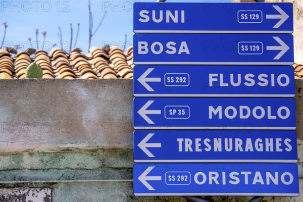 Sardinia, road signposts to places, Tinnura, Europe, Province of Oristano, Italy, architecture, outdoor, signposting, village, distances, area, signpost, identity, information, culture, landmark, navigation, orientation, places, place name sign, region, travel, direction, sign, sightseeing, location, road, road signpost, tourism, environment, traffic, signpost, destination, Italian, rural, Mediterranean, touristic, typical, public