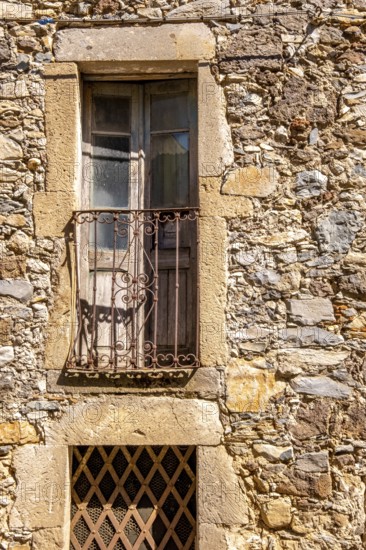 Sardinia, house facade with balcony and weathered wooden balcony door, brown balcony lattice, Santu Lussurgiu, Europe, Oristano province, Italy, old building, architecture, exterior view, balcony, charm, detail, village, window, building, house facade, home, masonry, sightseeing, structure, Southern Europe, tourism, vintage, residential building, historical, cultural, rural, Mediterranean, rustic, traditional, weathered wooden balcony door