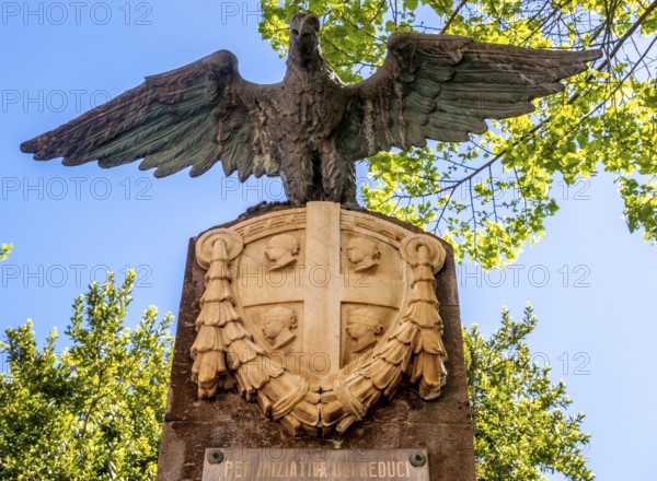 Sardinia, eagle and national flag in stone, Per iniziativa del Reduci, Santu Lussurgiu, Europe, Province of Oristano, Italy, eagle, architecture, outdoor, preservation, monument, heritage, memory, flag, memorial, history, identity, insignia, culture, art, national flag, place, perspective, politics, relief, sightseeing, sculpture, stone, symbolism, daylight, tourism, tradition, bird, landmark, Italian, rural, national, regional, stone, public