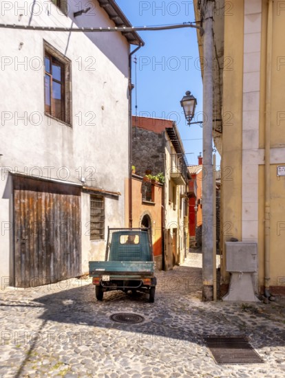 Sardinia, Small van Ape in the alleys of Santu Lussurgiu, Europe, Province of Oristano, Italy, old town, Ape, architecture, village, vehicle, alleys, building, island, small van, culture, van, cobblestones, travel, Santu Lussurgiu, sightseeing, summer, town, alleyway, structure, scene, day, tourism, transport, environment, charming, narrow, historical, Italian, rural, picturesque, Mediterranean, quiet, traditional, winding