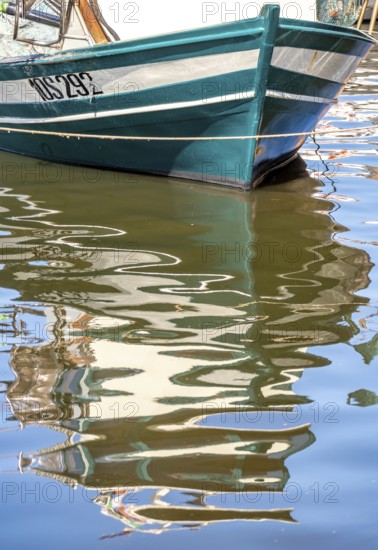 Sardinia, front of a fishing boat with reflection in the river Temo, Bosa, Europe, Province of Oristano, Italy, boats, fishing boat, river, river landscape, idyll, coast, landscape, nature, navigation, reflection, journey, destination, calm, ship, sea route, sightseeing, reflection, still life, scene, daylight, Temo, tourism, front, water, Italian, picturesque, Mediterranean, calm water, sunny, traditional, warm