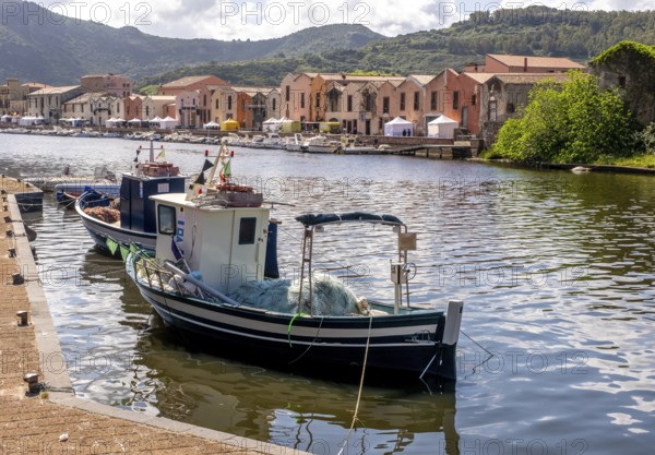Sardinia, fishing boat in the harbour of Bosa, harbour mile promenade with pavilions and boats on the river Temo, Bosa, Europe, Province of Oristano, Italy, mooring, architecture, boats, fishing boat, fishing, fishing net, river, river bank, leisure, spring, building, harbour, harbour mile, sky, idyllic, coast, nature, pavilions, promenade, terraced houses, travel, sightseeing, urban, day, Temo, tourism, transport, surroundings, holiday, water, living, blue, peaceful, maritime, Mediterranean, gentle, sunlit, traditional
